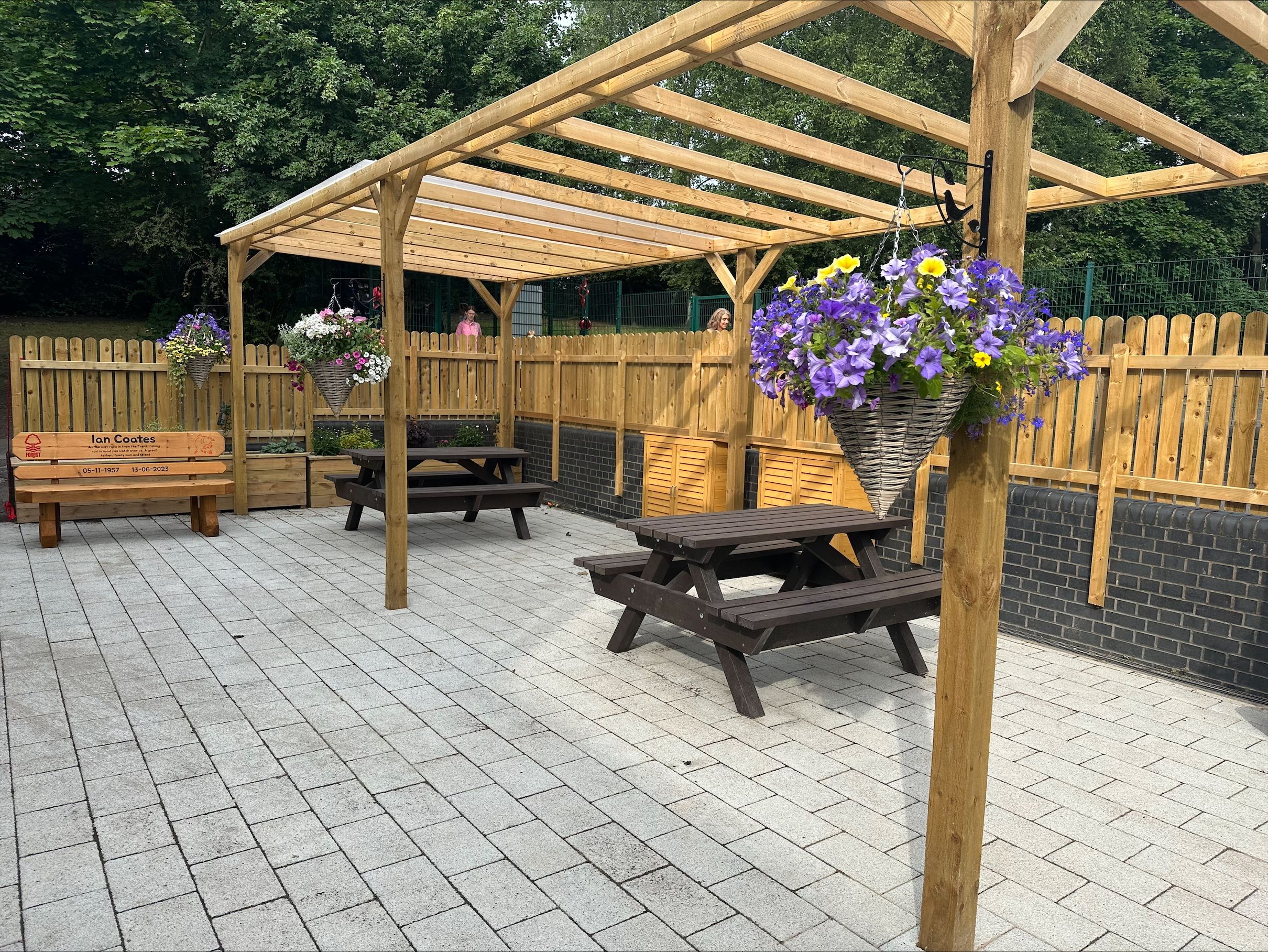 Huntingdon memorial garden patio area hanging baskets