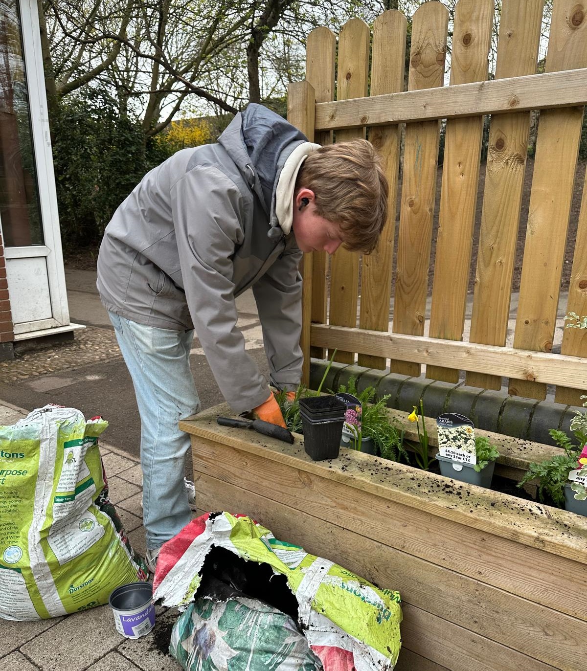 Huntingdon Allotment volunteer working on flower bed
