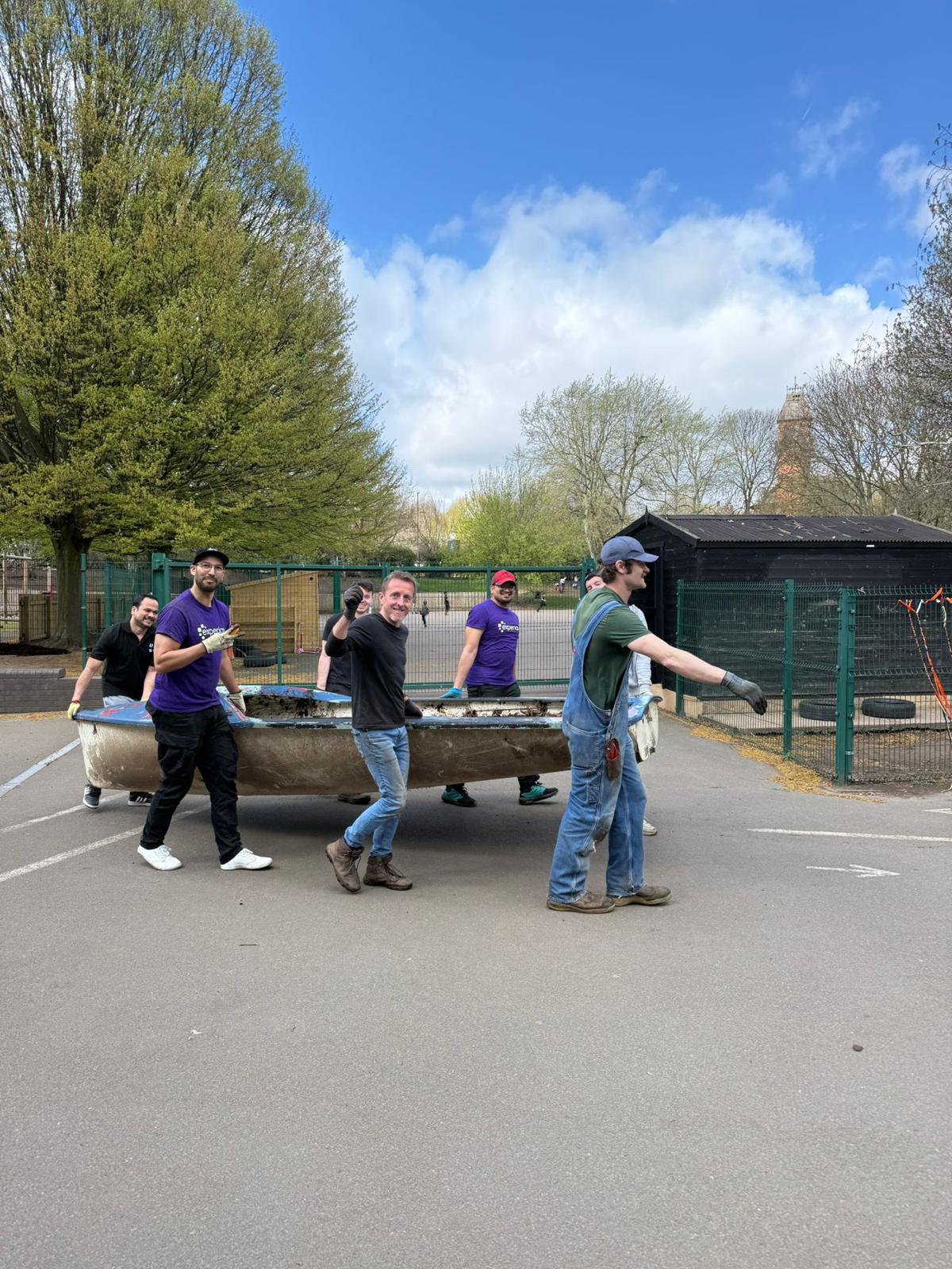 Huntingdon allotment volunteers carry boat