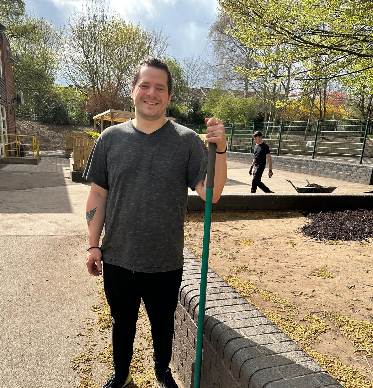 huntingdon Allotment volunteer with broom
